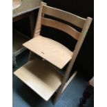 A Stokke Tripp Trapp beechwood child's high chair