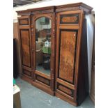 An oak and burr walnut veneer three part wardrobe, central mirrored door, approx. 200cmW