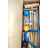 A croquet set in cardboard box