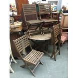 A set of four folding garden chairs together with matching table, 110cmW