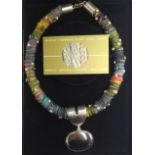 Lovely boxed necklace in braided silk/cotton with sterling silver and stone pendant