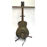 A Dean resonator guitar, with aged brass finish, in soft case