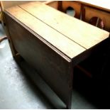 An oak drop leaf table, on square section legs, 96cmW, 145cmL when extended