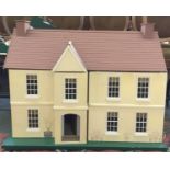 A large dolls house, with electrical wiring in place, and some furnishings, 89x48x70cmH