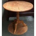 A modern pine circular tripod table, approx. 77cmD