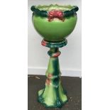 A large ceramic planter on stand, 33" high