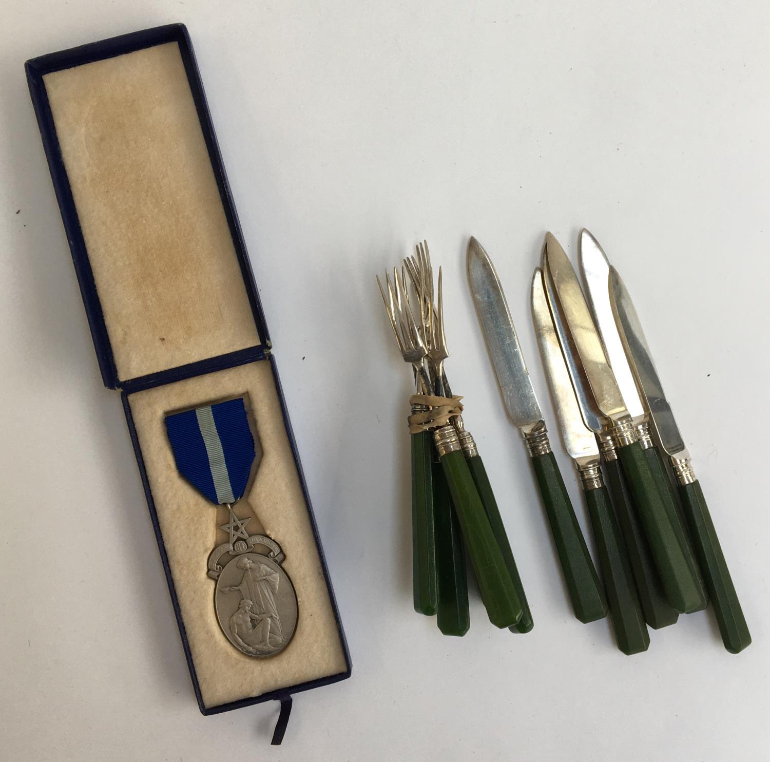 A Masonic silver medal, London 1933; together with a set of six silver pastry knives and forks,