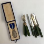 A Masonic silver medal, London 1933; together with a set of six silver pastry knives and forks,