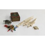 A selection of interesting trinkets, to include four carved bone items; a pewter pig; ten glass