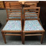 A good set of four oak dining chairs, with drop-in upholstered seats, on square tapered legs, with