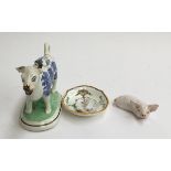 A 19th century Staffordshire cow creamer (af), decorated with Willow pattern in underglaze blue,