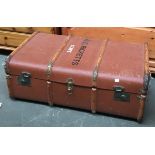 A wood banded canvas covered travel trunk, the topped marked 'A.C. Ricketts, Clive', 84cmW