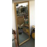 A modern gilt framed long mirror, 105x39cm