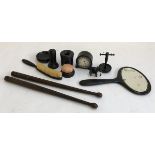 An ebony dressing table set; together with a pair of tribal carved drumsticks