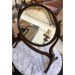 An oval mahogany adjustable dressing mirror, 50cmH