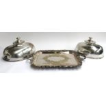 A pair of large silver plated meat cloches, both crested, 35.5cm and 31cm long; together with a