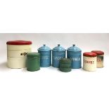 A number of vintage enamel kitchen tins, coffee, tapioca, oatmeal and a three tiered cake tin
