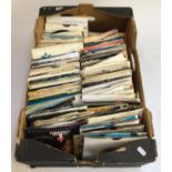 A large box of vinyl singles to include Shirley Bassey, Soft Cell, Axel F, Evelyn King etc