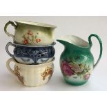 Three ceramic chamber pots and a wash bowl