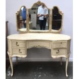 A 1960s white painted dressing table, with three part adjustable mirror, above the usual arrangement