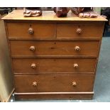 A Victorian pine chest of two short over three long drawers, turned wood handles, 107x50x111cmH