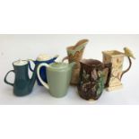 A small lot of jugs and teapots, to include Poole pottery