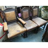 A set of five late 19th/early 20th century dining chairs, one a carver, carved top rail