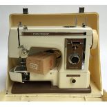 A Frister and Rossman Model 503 electric sewing machine, in case