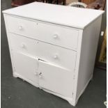 A white painted pine chest with two drawers over two cupboard doors, 85x52.5x82cmH