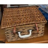 A wicker picnic hamper, with contents