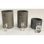 Three Swarovski crystal figurines, a parrot (7621), owl (7621), and one other owl, all boxed (3)