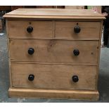 A small pine chest of two short over two long drawers, with ebonised handles, 91x48x85cmH
