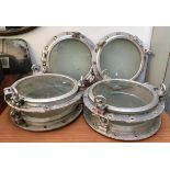 A set of six galvanised ships portholes, each approx. 54cmD; together with seven hardboard canvas