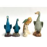 A lot of four continental ceramic bird figures, three ducks and one parrot (4)