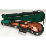 A half size student Violin in hard carry case