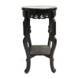 A carved Chinese hardwood plant stand, 55cmH