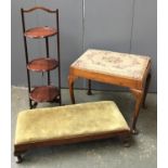 A long mahogany footstool, 20th century stool on cabriole legs, small three legged wooden trivet,