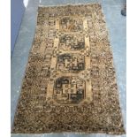 A West Persian carpet with triple border, 215x117cm