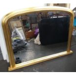 A gilt framed over mantel mirror with domed top, 91.5cmW