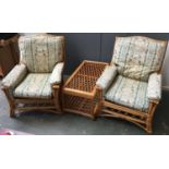 A pair of wicker conservatory chairs, with cushions and matching conservatory coffee table