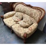 An early 20th century Italian two seater sofa, shaped rail and scolling acanthus capped supports,