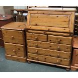 A modern pine bureau with four drawers, 86cmW; together with a modern pine bedside cabinet of two