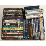 A wicker basket containing approx. 40 DVDs