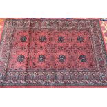 A John Lewis burgundy wool rug, 200x134cm