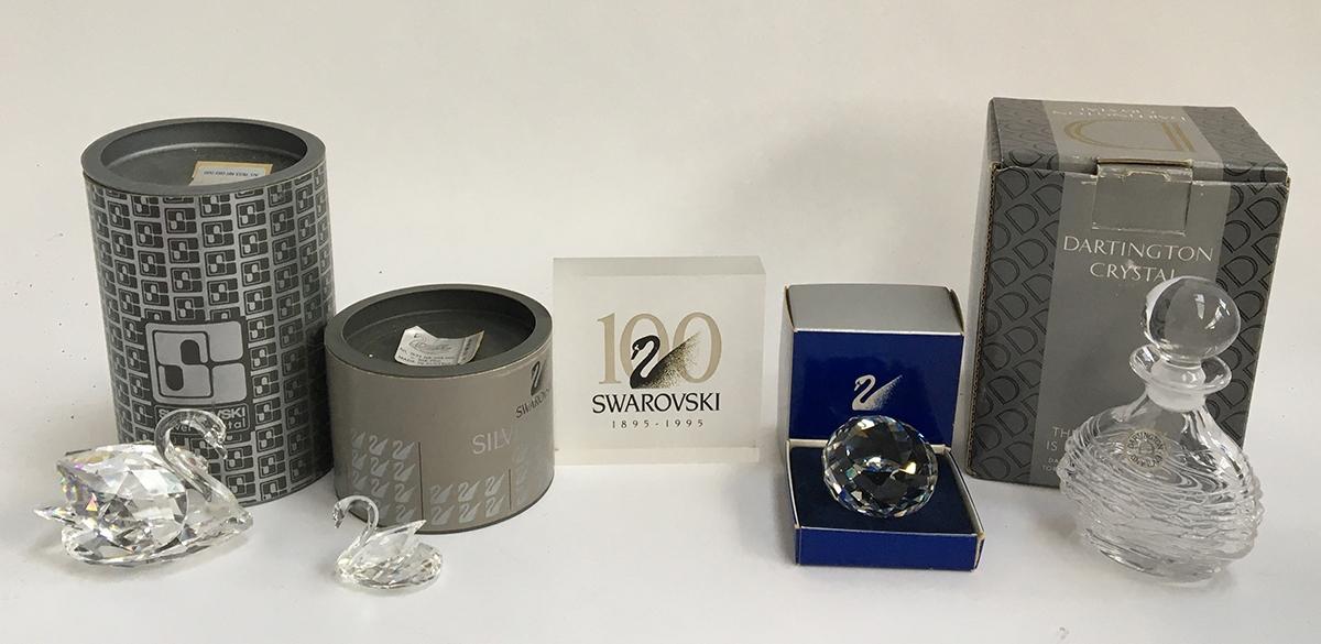 Two Swarovski crystal figurines, a large swan (7633) and small swan (7633), each in original