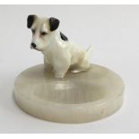 A Royal Doulton figurine ashtray of a sitting dog mounted upon onyx base (af), marks to base of dog,