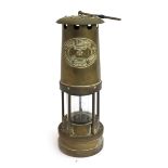 A brass 20th century Thomas & Williams 'Cambrian' miner's lamp, cylindrical with glass centre,