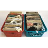 Two crates of vinyl singles (one blue, one red)