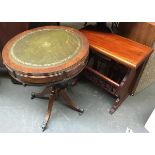 A small drum table with leather inset top, 50cmD; together with a hardwood magazine rack