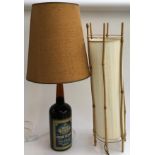 A 'Cherry Heering' bottle converted table lamp, with 1970s style shade; together with one other